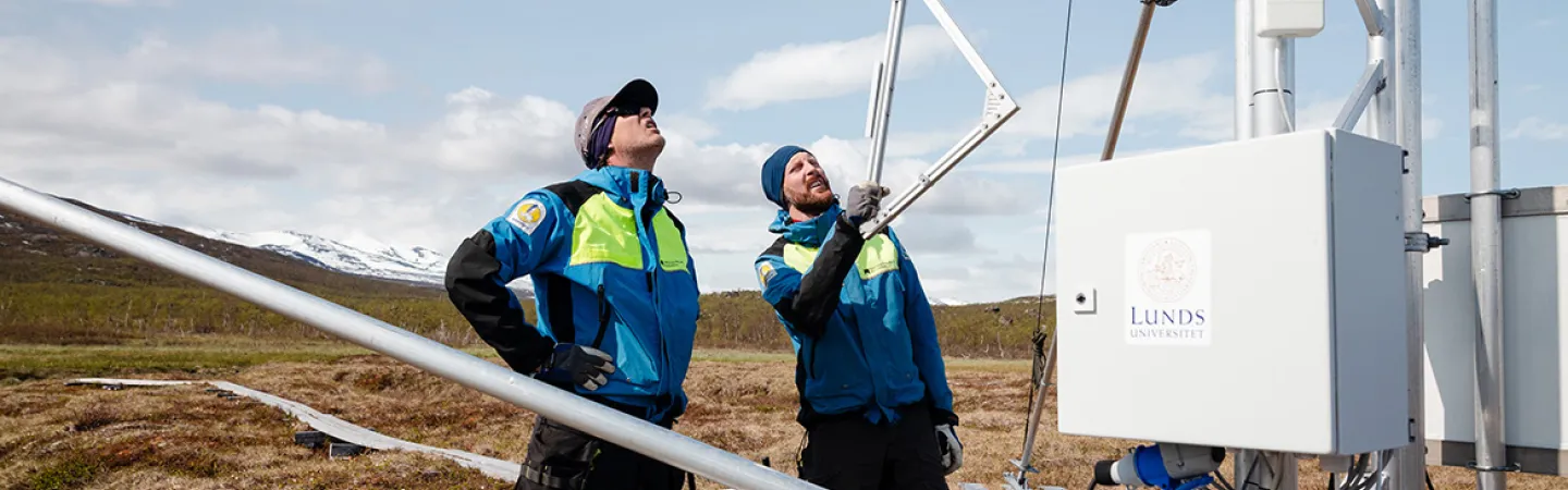 Two scientists looking at instrumentation